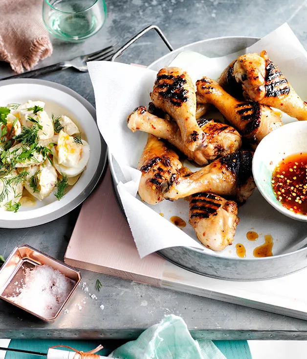 Southern barbecue chicken drumsticks with mop sauce and potato salad