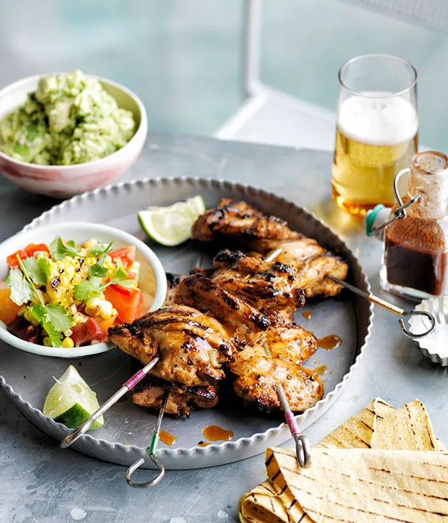 Smoky chilli chicken with barbecued corn, crushed avocado and soft tacos