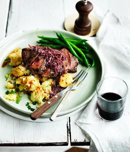 Flat-iron steak with red wine and ginger sauce and crushed potatoes