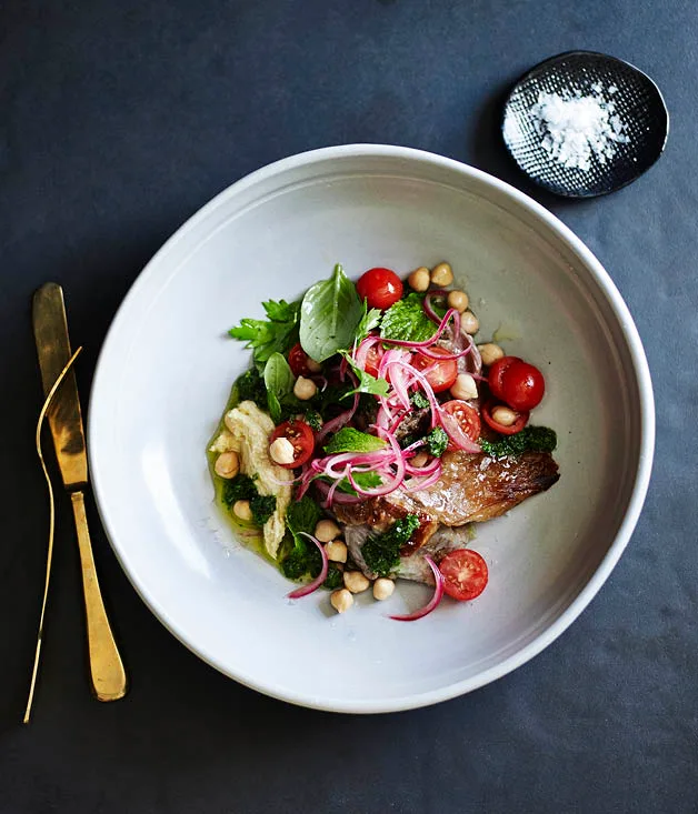 Slow-cooked lamb with hummus, tomato salad and mint salsa