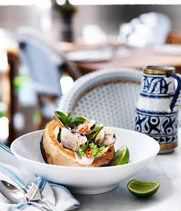 Pipis grilled in a young coconut with chilli and ginger