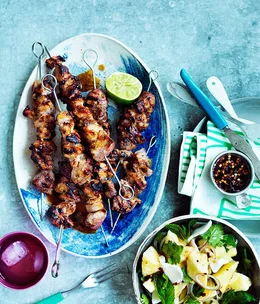 Pork skewers with young coconut and pineapple salad