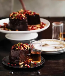 Chocolate mousse tart with pomegranates and pine nuts