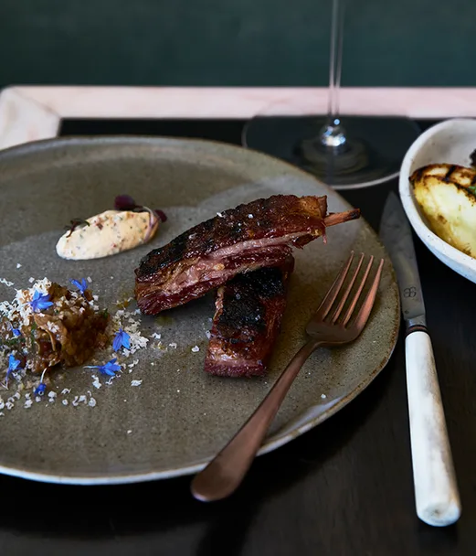 Barbecued lamb ribs with smoked eggplant and yoghurt sauce
