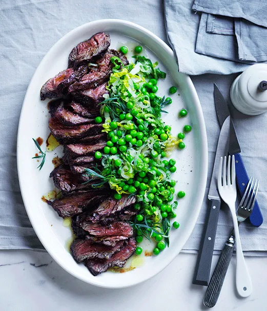 Pepper hanger steak with peas and lettuce