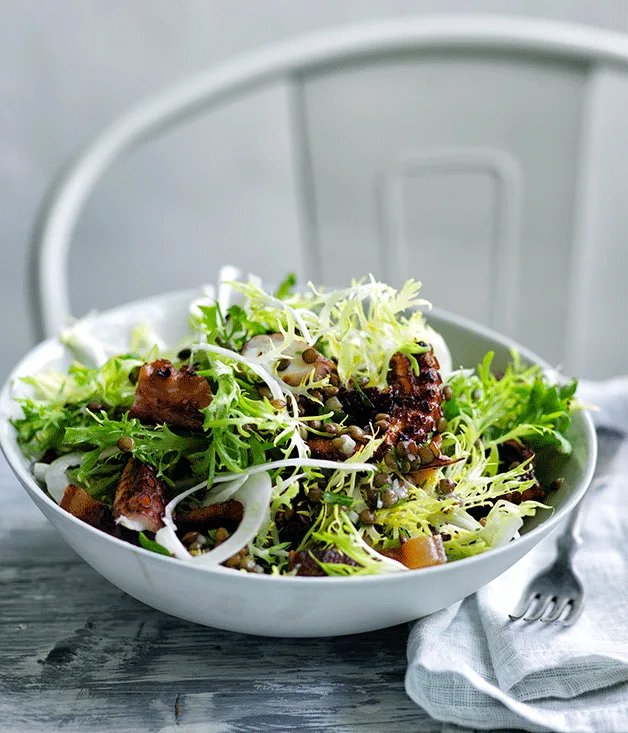 Octopus, frisée and fennel salad with lardons and lentil dressing