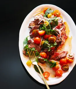 Rare beef with tomato, herb and chilli salad