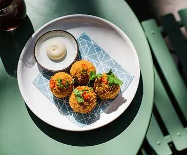 XO arancini, part of the new brunch menu at Potts Point eatery Paper Bird.