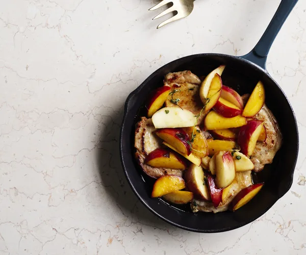 Pork medallions with nectarines and potato salad