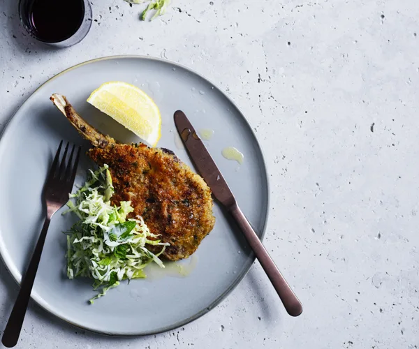 Veal cotoletta with cabbage, mint, apple and dill