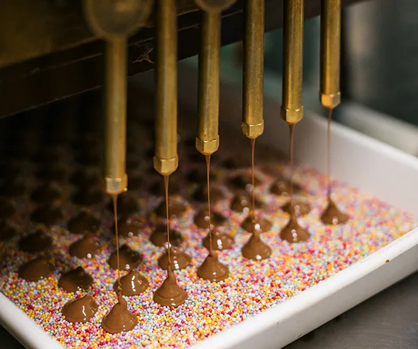 Speckle chocolates in production at Haigh's chocolate factory