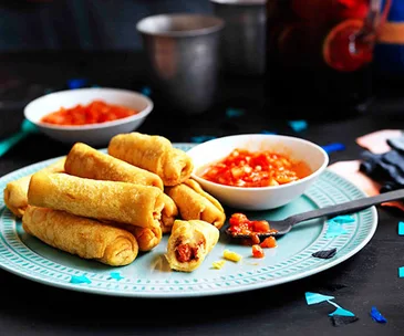 Potato taquitos with salsa roja