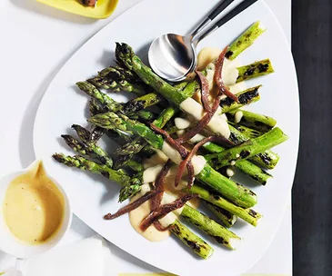 Grilled asparagus with parmesan cream and anchovies