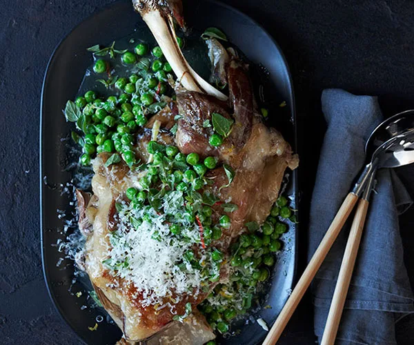 Lamb shoulder braised in wine with peas and pecorino