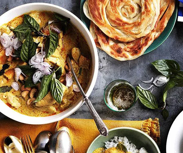 Chicken and bamboo-shoot yellow curry with roti and rice