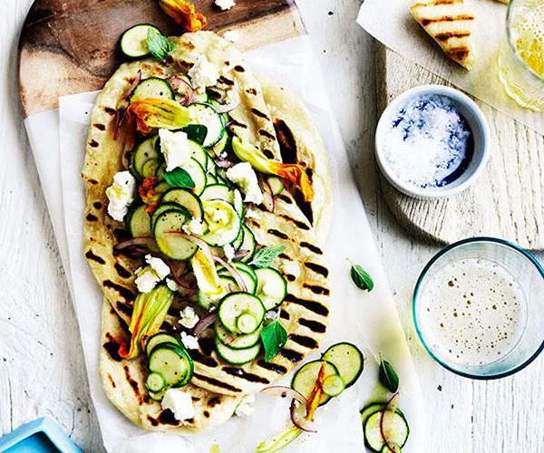 Speedy yoghurt flatbread with zucchini flowers and feta