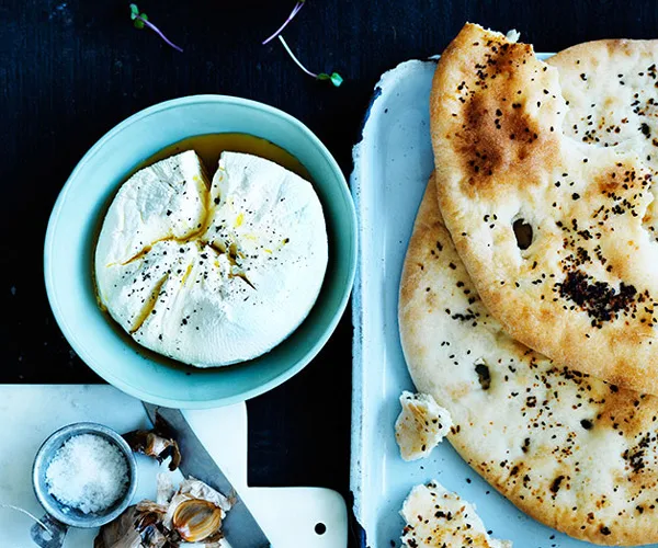 Overnight Afghan bread with labne and black garlic