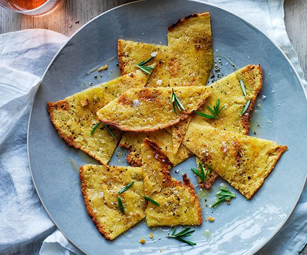 Socca with rosemary and olives