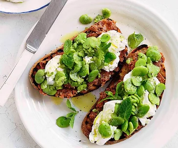 Grilled sourdough with ’nduja, smashed broad beans and green garlic