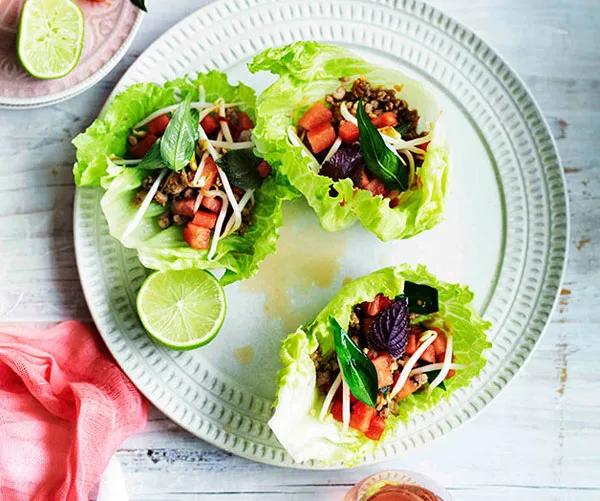 Pork in lettuce cups with watermelon and bean sprouts