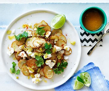 Warm golden potato salad with lime butter and coriander