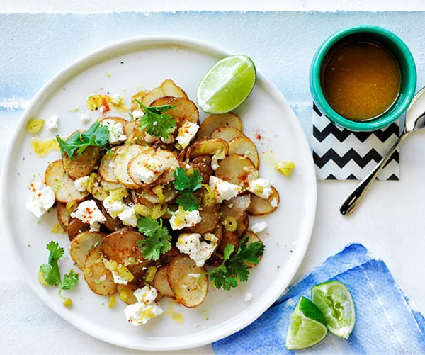 Warm golden potato salad with lime butter and coriander