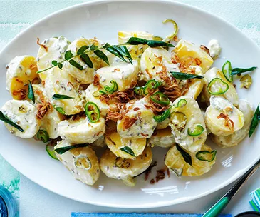 Spiced potato salad with yoghurt dressing and fried onion