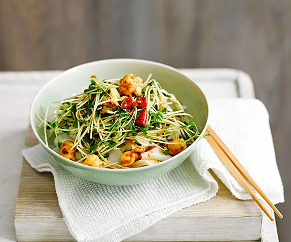 Rice noodles with snow pea sprouts and prawns