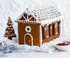 A .gif video showing a gingerbread house being constructed and iced.