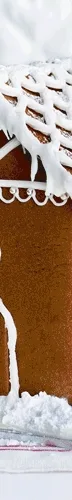 A .gif video showing a gingerbread house being constructed and iced.