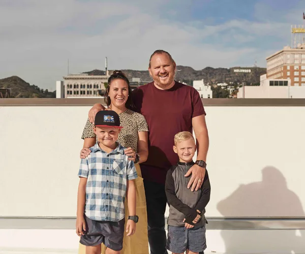 Jaci and Monty Koludrovic with their sons.