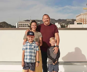 Jaci and Monty Koludrovic with their sons.
