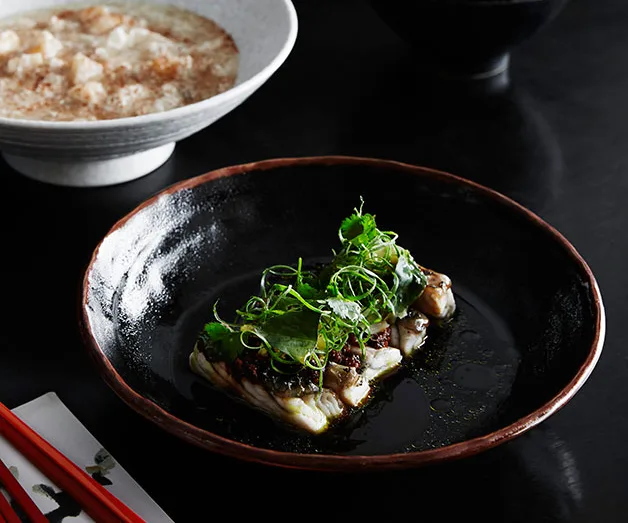 Steamed barramundi, chilli black beans and pickled mustard greens