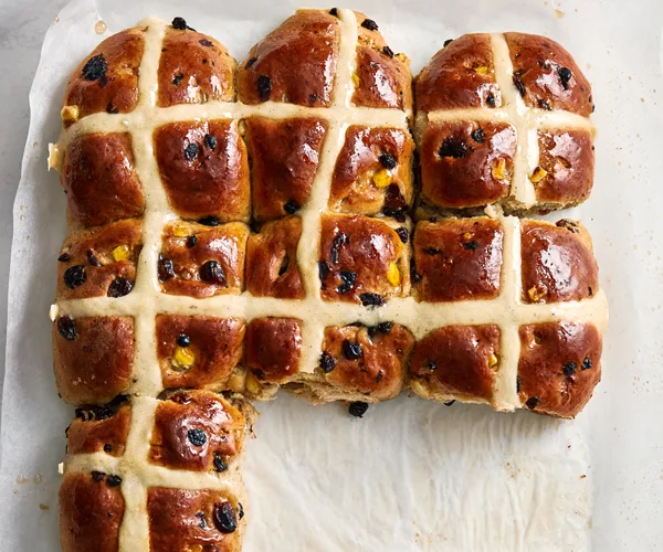 Best hot cross buns recipe - Seven hot cross buns with glazed tops and sticky fruit filling.