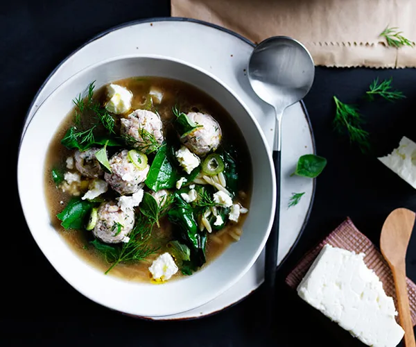 Tiny chicken meatball and orzo soup with silverbeet and feta