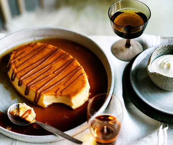 Milk flan with dulce de leche and whipped cream