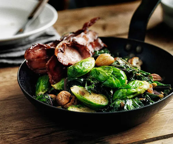 Sautéed Brussels sprouts with curly kale, bacon and chestnuts