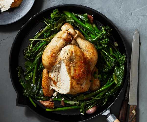 Roast chicken with anchovy butter and greens