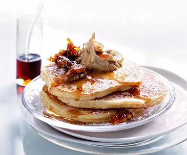 Cinnamon pancakes with whipped maple butter and candied walnuts