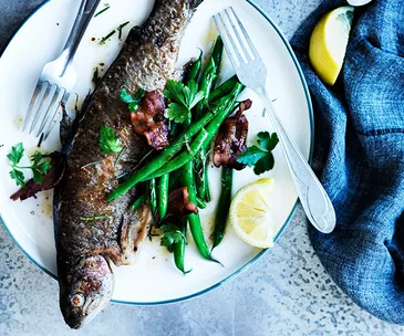 Rainbow trout with almonds, bacon and green beans