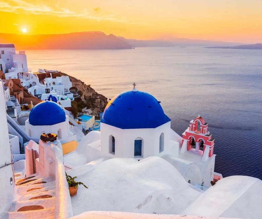 The picturesque Oia village at sunrise in Santorini, Greece.