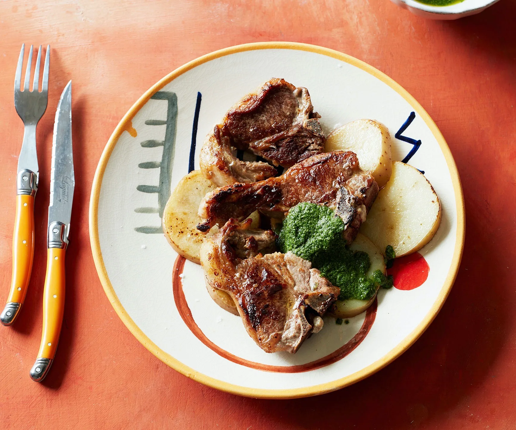 Lamb chops with salsa alla menta and potatoes