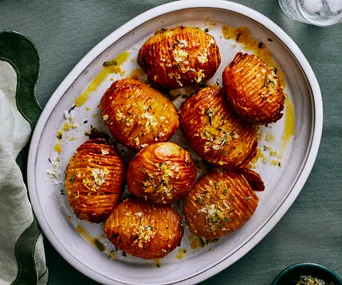 Bowl of duck-fat hasselback roast potatoes