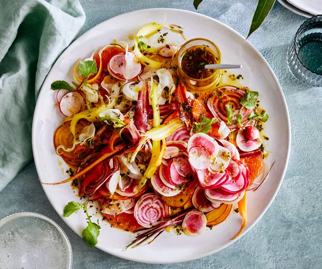 flat lay image of colourful vegetable salad with ruby grapefruit