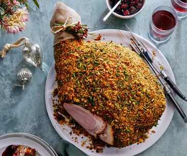 Amaretto and cherry-glazed ham with pistachio and herb crust