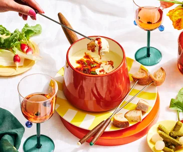 Three-cheese fondue with chorizo oil and crudités