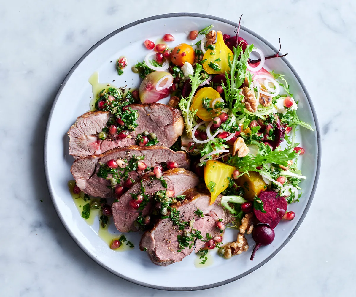 Sliced cooked lamb, beetroot and walnut with herb dressing