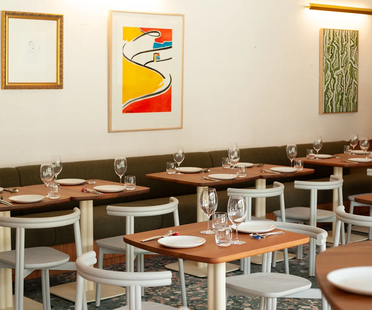 Sleek dining room at Canberra restaurant Such and Such with colourful artwork