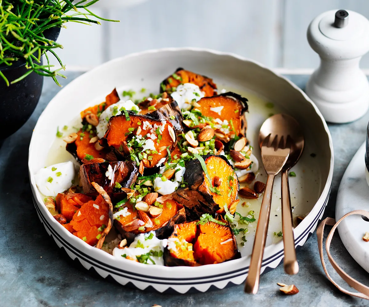 Sweet potato roasted in a bowl topped with goat's curd