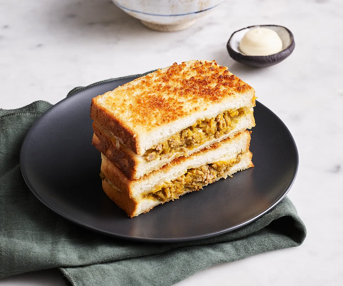 Curry bread (kare pan toasties) on a dark grey plate